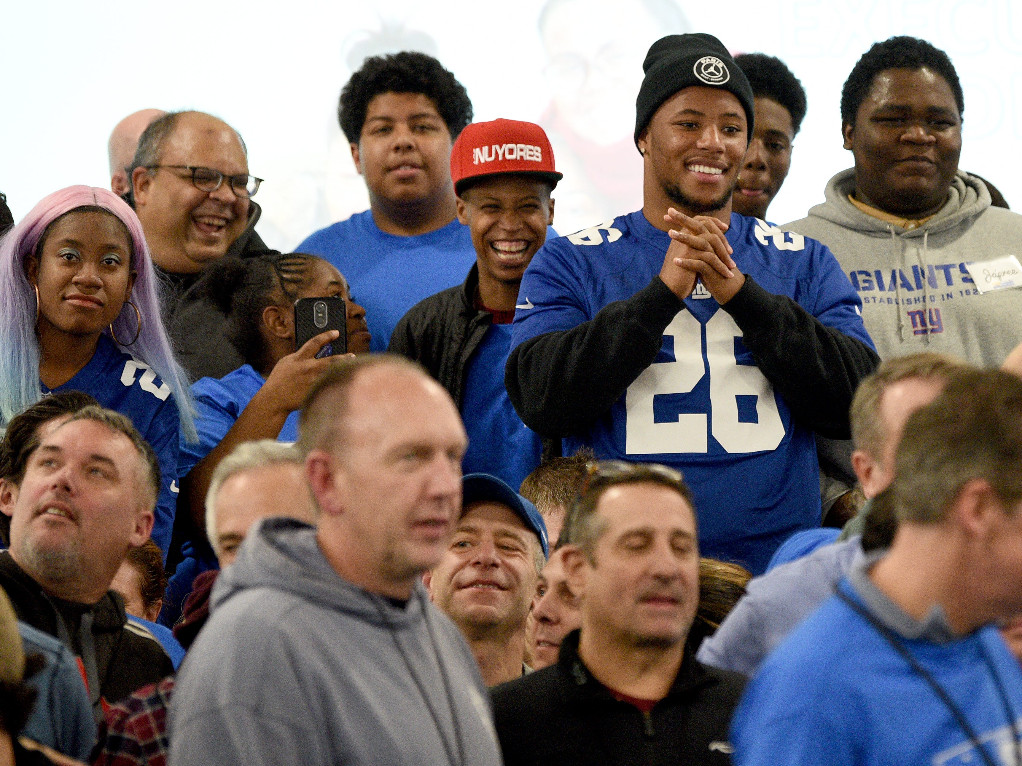 Covenant House holds a Sleep Out Executive Edition in Newark on Thursday November 21, 2019. Covenant House kids and fundraisers prepare to take a photo with Saquon Barkley a player with the Giants and Sleep Out: Executive Edition Chairman.