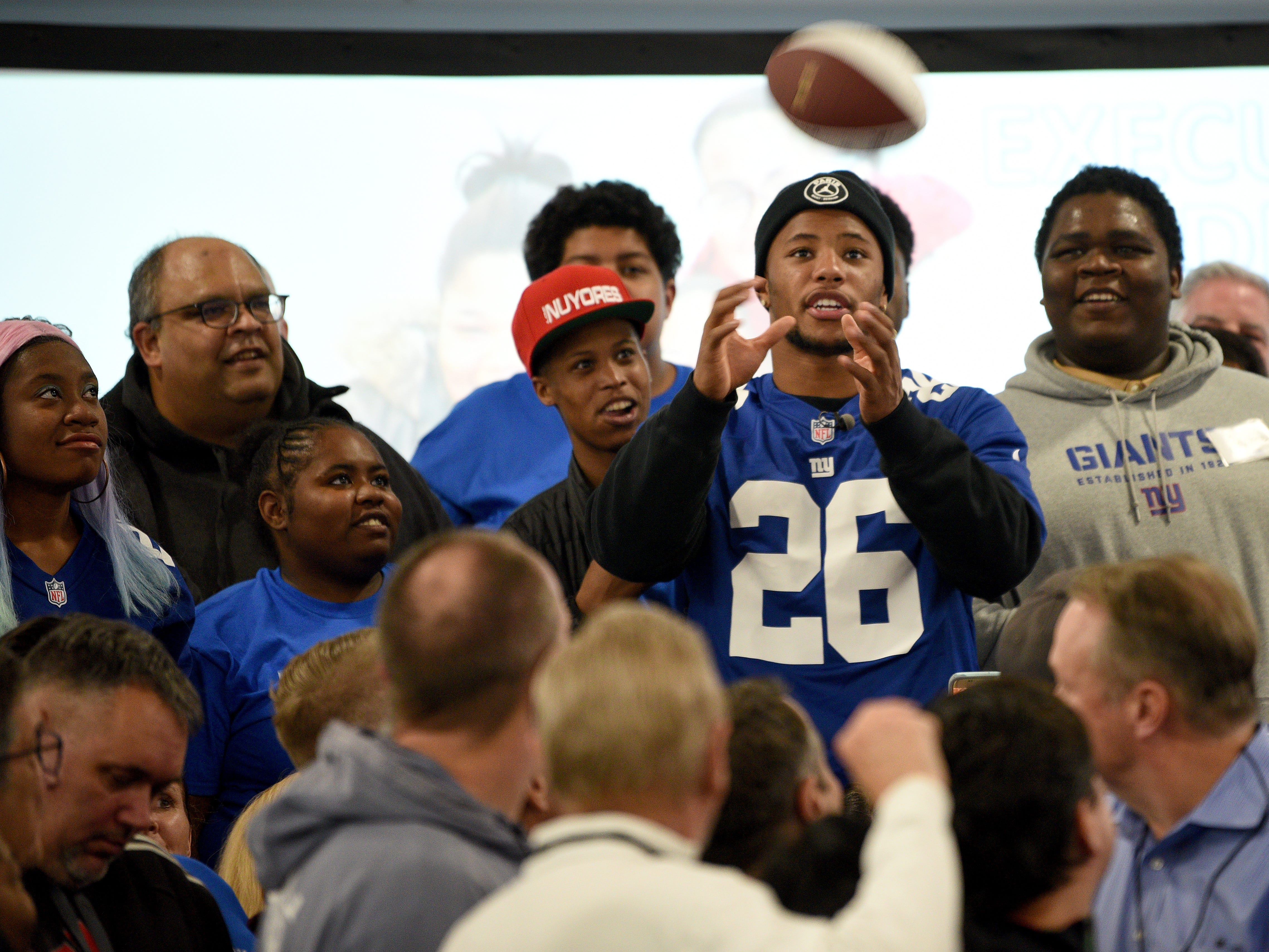 Covenant House holds a Sleep Out Executive Edition in Newark on Thursday November 21, 2019. Covenant House kids and fundraisers prepare to take a photo with Saquon Barkley a player with the Giants and Sleep Out: Executive Edition Chairman.