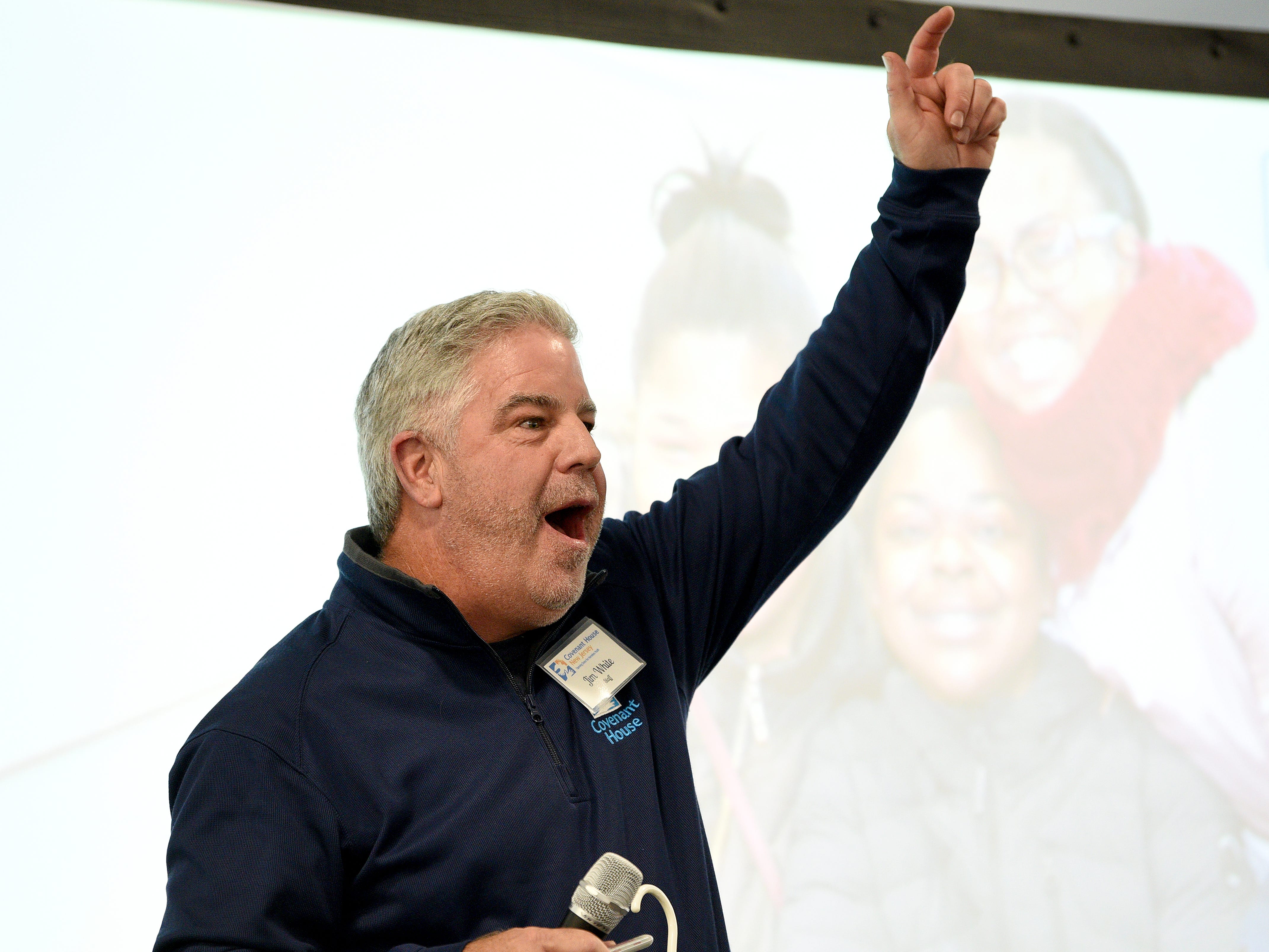 Covenant House holds a Sleep Out Executive Edition in Newark on Thursday November 21, 2019. Jim White gestures when he announces how much money was raised by one person. 