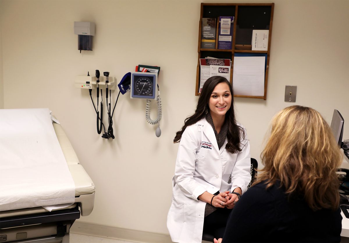 Nutritionist/dietitian Courtney Schuchmann confers with a patient in her office. 