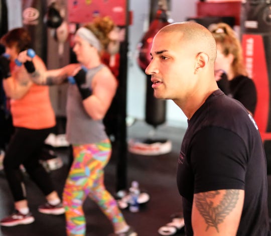 Brian Daniels, co-owner of EmPOWer gym teaches a class on Saturday, Nov. 23, 2019.