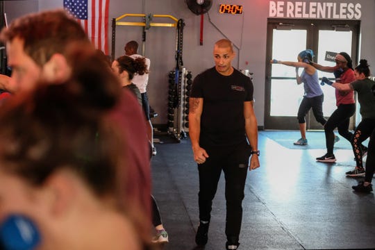 Brian Daniels, co-owner of EmPOWer gym, teaches a class on Saturday, Nov. 23, 2019.