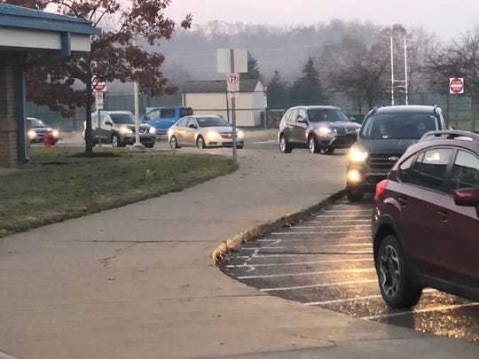 Vehicles lined up to drop off students at Novi Middle School before 8 a.m. on Nov. 26, 2019. District officials are considering a change in start times.