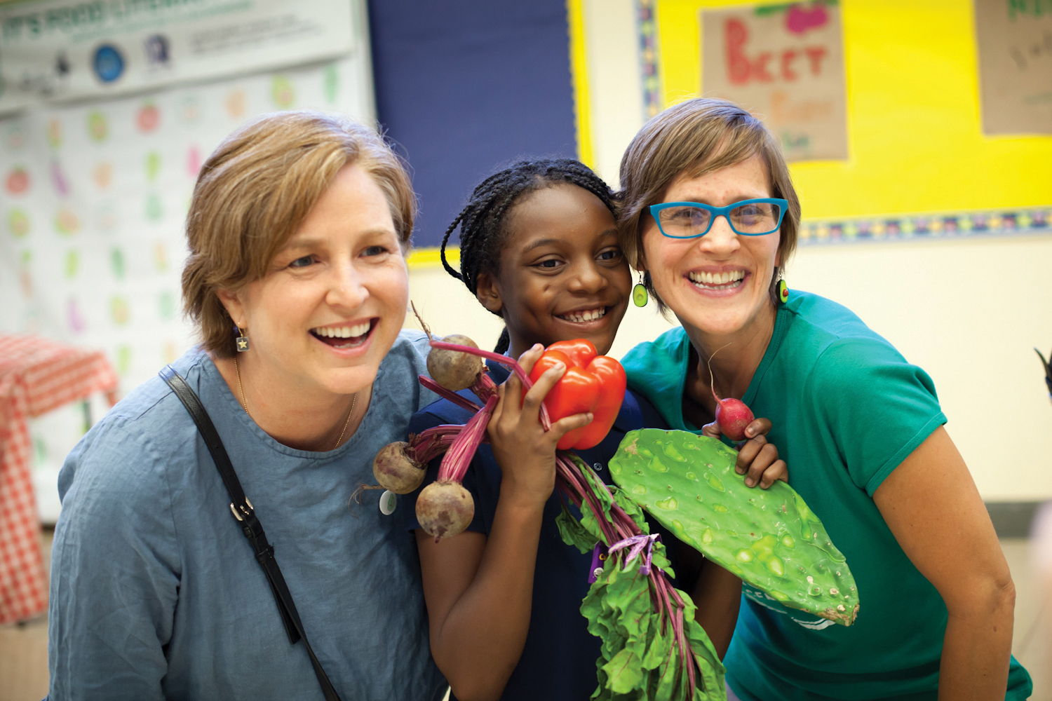 “It’s easy to give a kid junk food. It takes a lot of joy and bravery to show up with vegetables. But kids notice when you do, because what they notice is that you care about them and their health,” says Amber Stott (pictured at right). (Photo by Amy Nicole)
