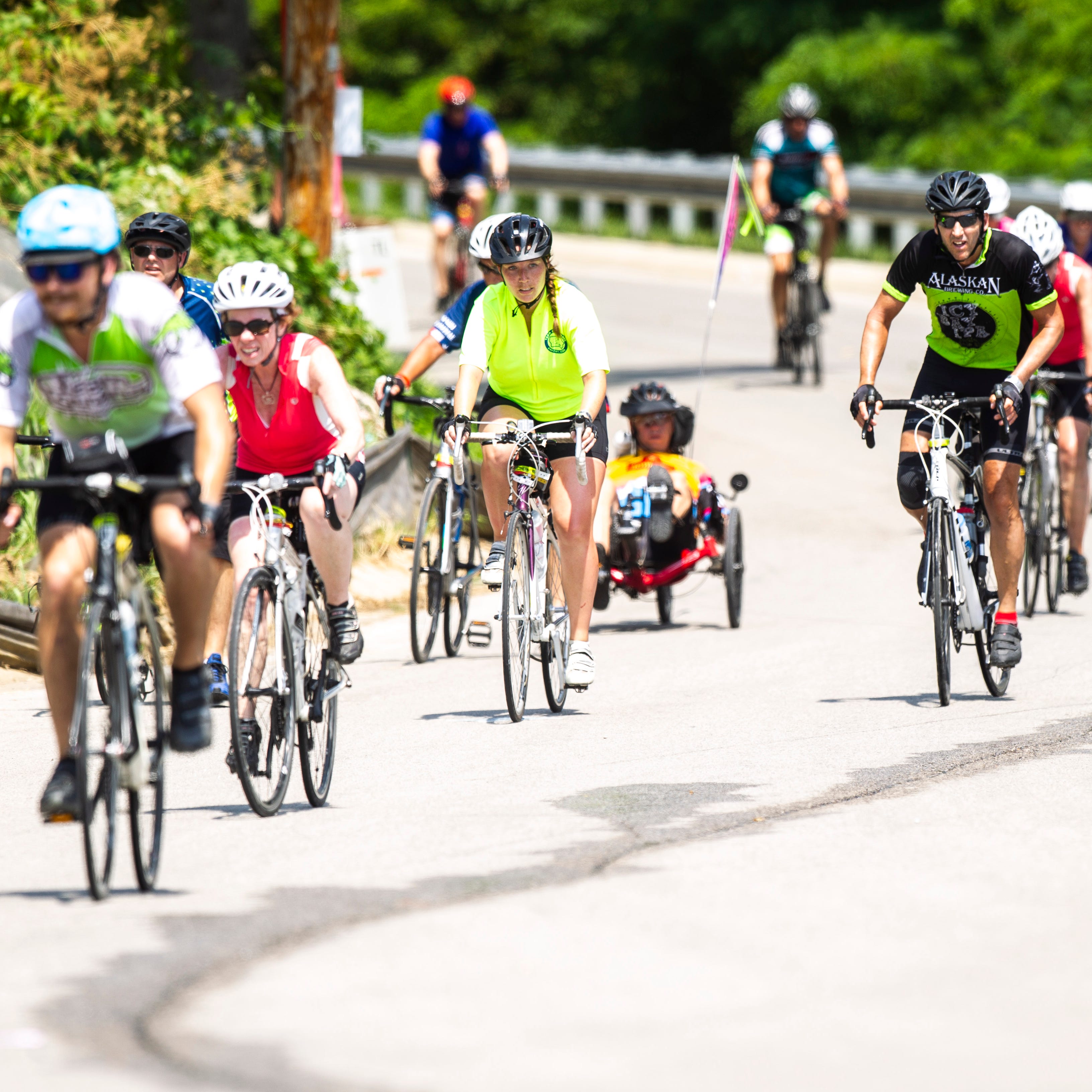 RAGBRAI riders make it to the top of the hill at Rand Park while nearing the finish of the 427 mile route on day seven, Saturday, July 27, 2019, in Keokuk, Iowa.