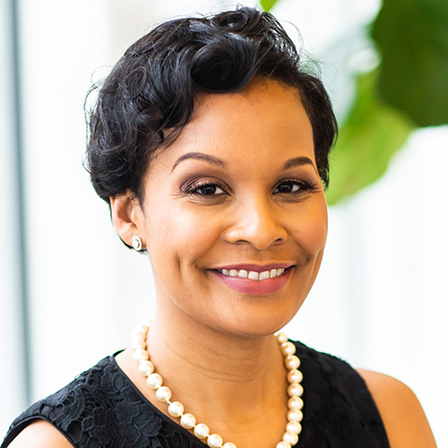 self-care: Regina Gavin Williams (headshot), clinical assistant professor of counselor education at North Carolina Central University, smiling woman with short dark hair, pearls, black sleeveless top.