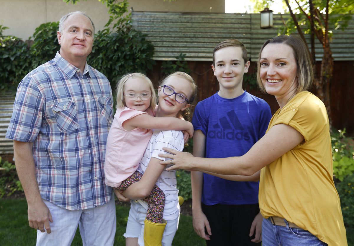 Jordan, Tori, Alexa, Jackson and Amanda Longwell are photographed at their home in Salt Lake City on Wednesday, July 29, 2020. The Longwells have decided as a family to return to remote learning this fall due to risks to Tori, who has Down syndrome, but also to the entire family.