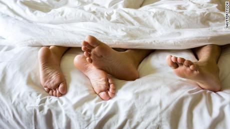 Get better sleep by cuddling up with your partner