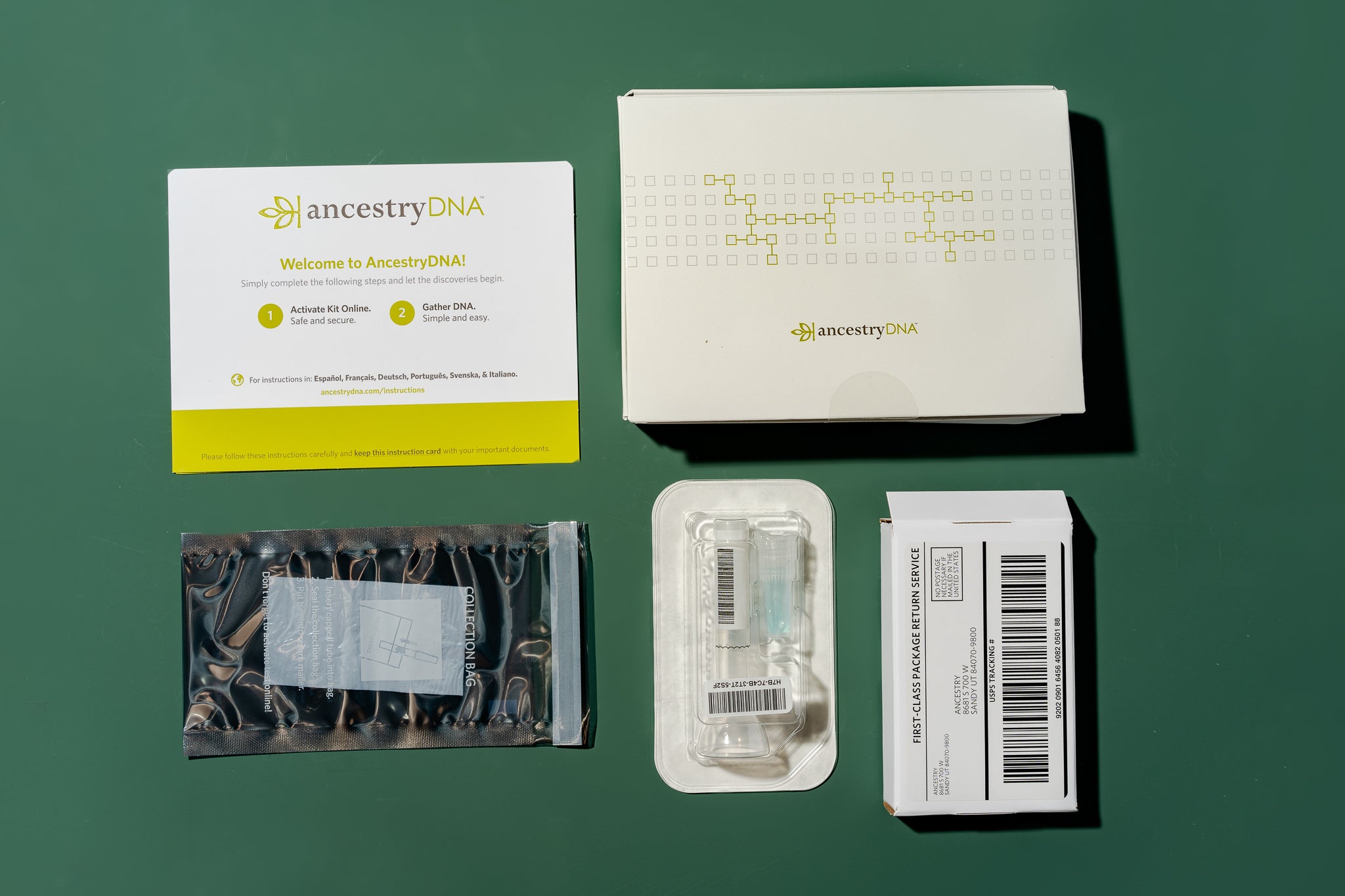 The Ancestry DNA kit shown unboxed, with all of its components.
